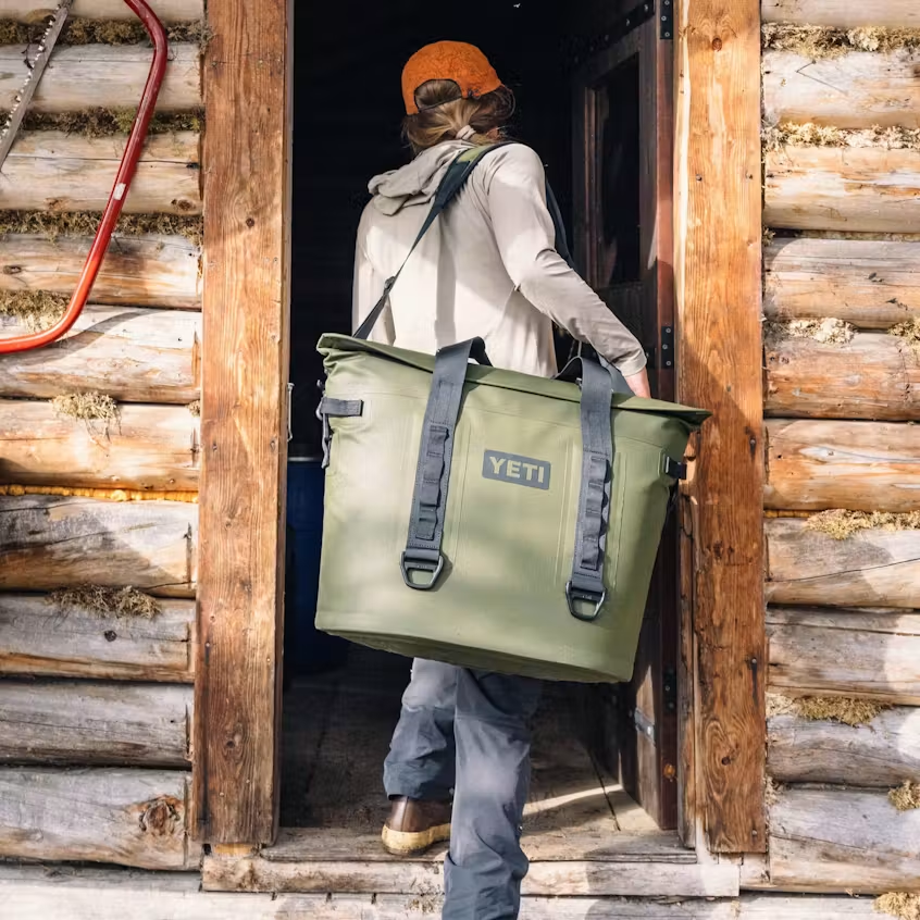 YETI Hopper M30 tote soft cooler carried into a backcountry cabin